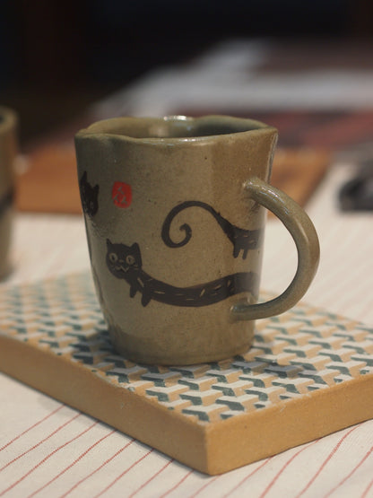 Ceramic stoneware handpinched cat mug with handpainted cat, perfect for gifting a coffee or tea enthusiast made in Malaysia, KL. Shipping to Singapore available.