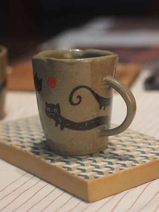 Ceramic stoneware handpinched cat mug with handpainted cat, perfect for gifting a coffee or tea enthusiast made in Malaysia, KL. Shipping to Singapore available.